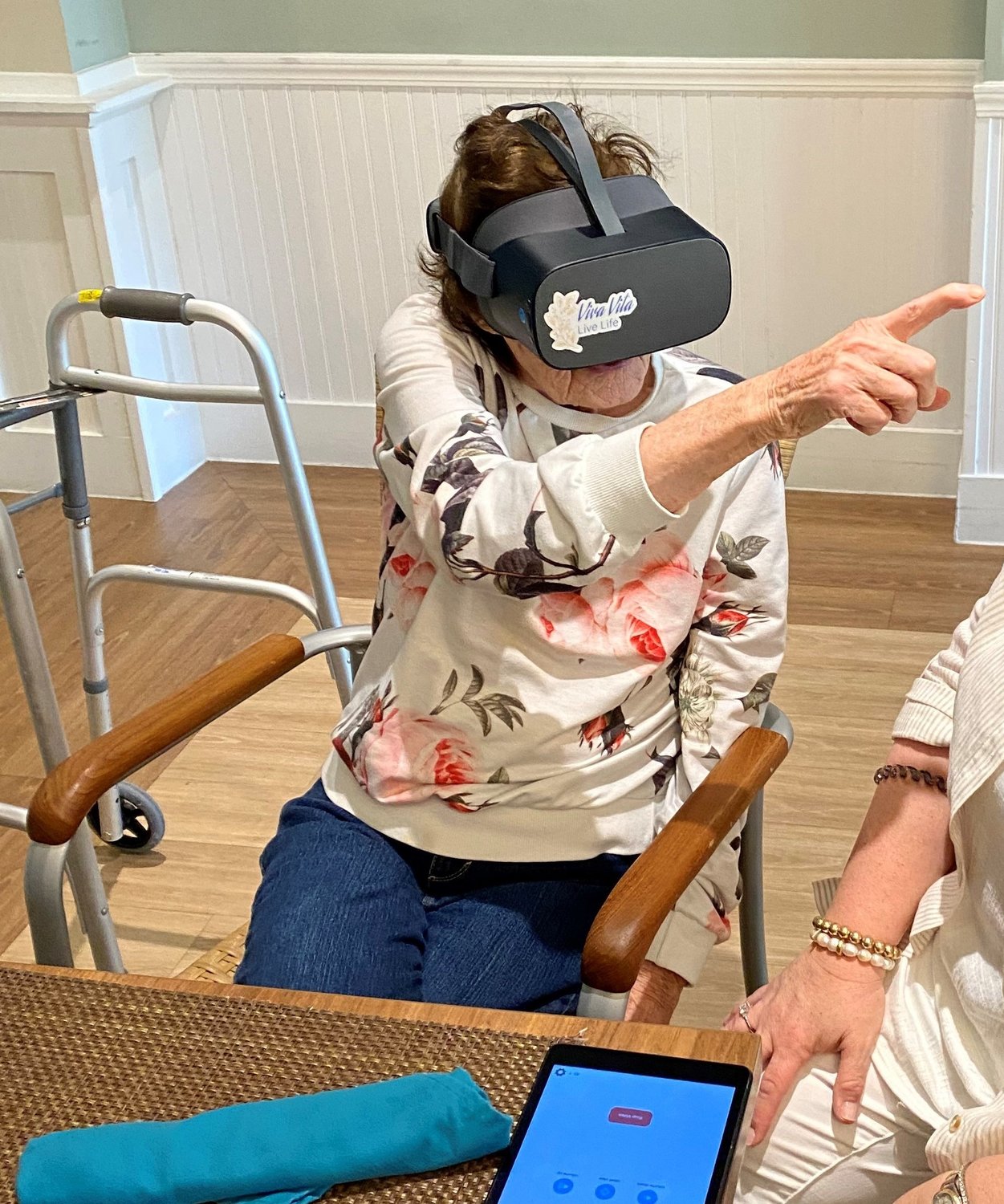 Azella is looking at London through the virtual reality program at Ponte Vedra Gardens Alzheimer’s Special Care Center.